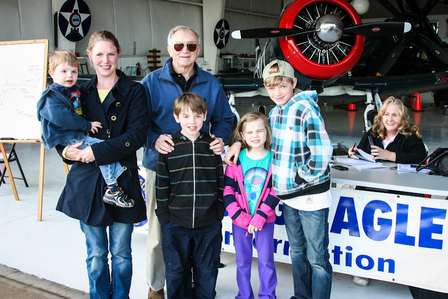 A family smiling to the camara